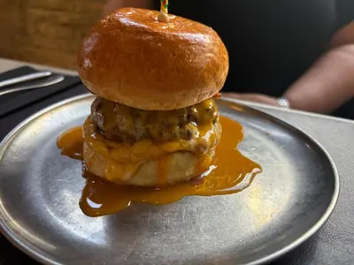 a sandwich with a donut on a plate at Studio 1 Port Valencia in Valencia
