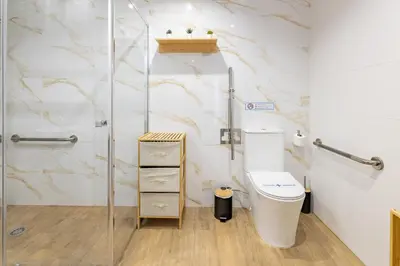 a bathroom with a glass shower and a sink at Travel Habitat Mediterranean Lofts in Valencia