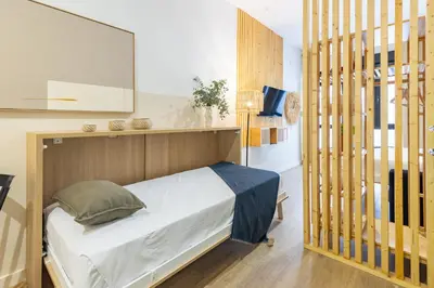 a bathroom with a shower and a toilet at Travel Habitat Mediterranean Lofts in Valencia