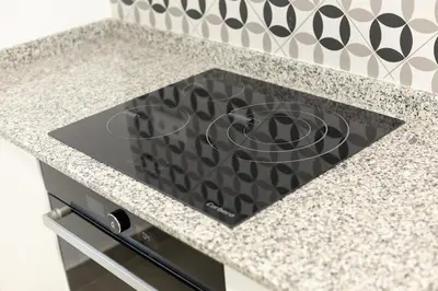 a stove top oven sitting on top of a kitchen counter at NEW BEACH Flats valencia 1 in Valencia