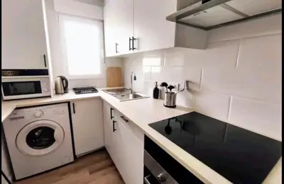 a kitchen with a washer and a washing machine at Apartamento 3 Habitaciones 2 Baños in Puerto de Sagunto