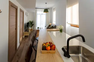 a kitchen with a counter with a bowl of fruit on it at Tenerias Apart Corp , 4 Piso in Valencia