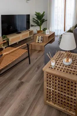 a living room with a couch and a tv at Tenerias Apart Corp , 4 Piso in Valencia