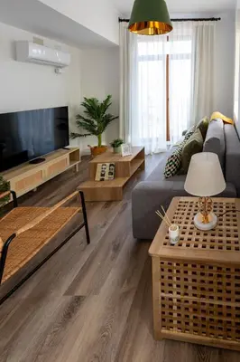 a living room with a couch and a tv at Tenerias Apart Corp , 4 Piso in Valencia