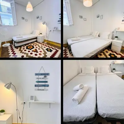 four different pictures of a bedroom with two beds at Habitación Maritim 2 in Valencia
