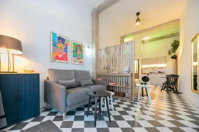 a living room with a couch and a table at Cozy loft Jubeco in Valencia