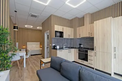 a living room with a couch and a kitchen at GuestReady - Quaint Stay in Valencia in Valencia