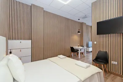 a bedroom with a bed and a table with a chair at GuestReady - Quaint Stay in Valencia in Valencia
