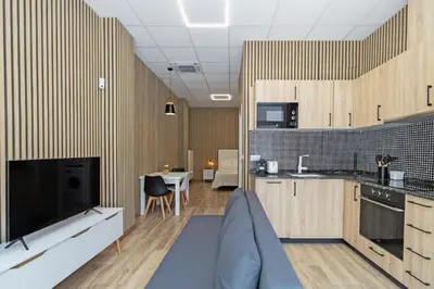 a living room with a couch and a kitchen at GuestReady - Delightful Valencian Stay in Valencia