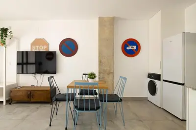 a dining room with a table and chairs at NEW BEACH Flats Valencia 2 in Valencia