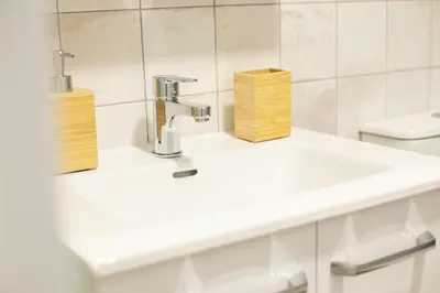 a bathroom with a sink and a faucet at NEW BEACH Flats Valencia 2 in Valencia