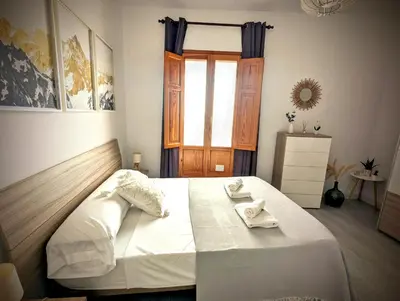 a bedroom with a bed with two towels on it at Casa Fina in Anna