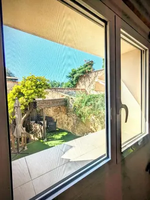 an open window with a view of a patio at Casa Fina in Anna