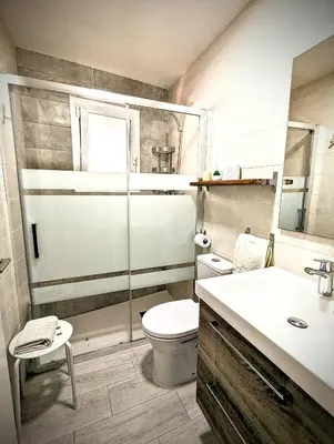 a bathroom with a toilet and a sink and a shower at Casa Fina in Anna