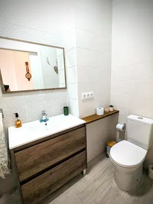 a bathroom with a sink and a toilet and a mirror at Casa Fina in Anna