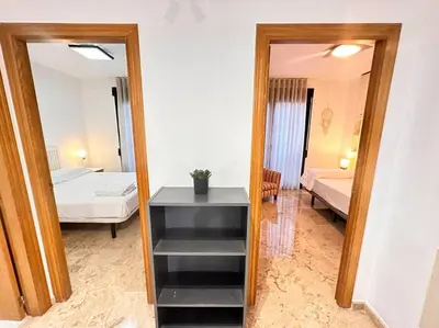 a room with a mirror and a bedroom with a bed at Amplio y Lujoso con vistas in Valencia