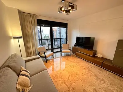 a living room with a couch and a flat screen tv at Amplio y Lujoso con vistas in Valencia