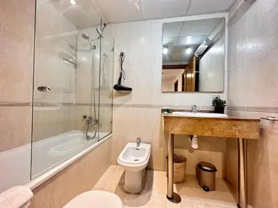 a bathroom with a toilet and a sink and a shower at Amplio y Lujoso con vistas in Valencia