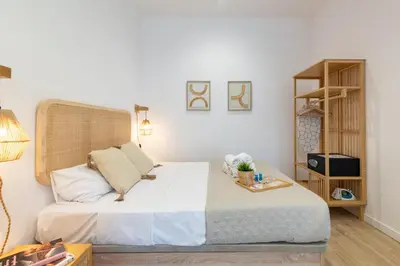a bedroom with a bed and a book shelf at Travel Habitat Ruzafa Lofts in Valencia