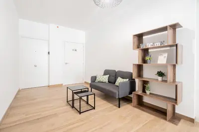 a living room with a couch and a table at VisitVal Flats 2 in Valencia