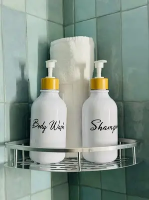 two bottles of soap on a shelf in a bathroom at New Industrial Design Flat in Russafa SOHO in Valencia