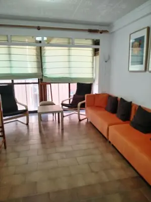 a bedroom with a bed with a towel on it at Apartamento con parking frente a la playa in Faro de Cullera