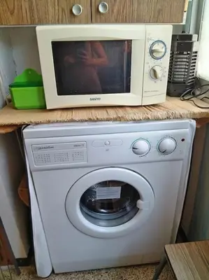 a bathroom with a toilet and a tub and a sink at Apartamento con parking frente a la playa in Faro de Cullera