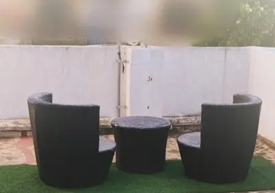 a group of three chairs sitting on the grass at Alojamiento junto Aeropuerto Valencia A in Manises