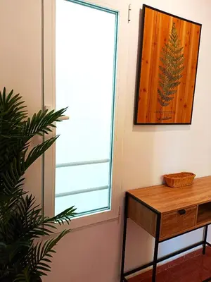 a window in a room with a table and a plant at Premium Beach Flat in Las Canteras