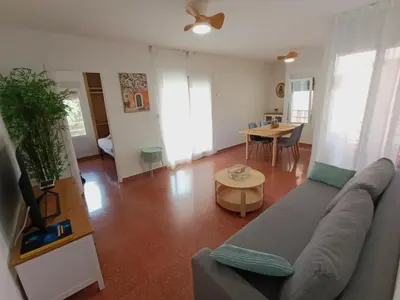 a living room with a couch and a table at Premium Beach Flat in Las Canteras