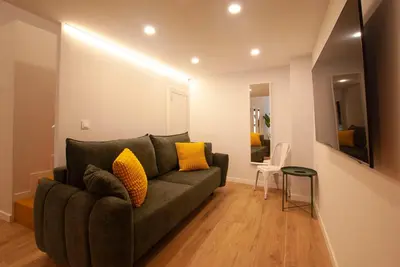 a living room with a couch and a table at Quiet Loft in Valencia