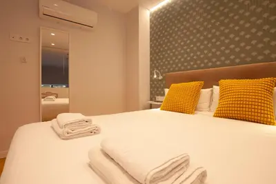 a bedroom with a bed with towels on it at Quiet Loft in Valencia