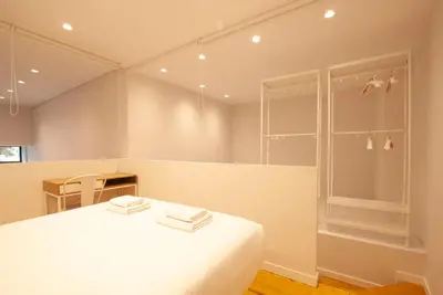 a bedroom with a white bed with towels on it at Quiet Loft in Valencia