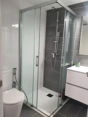 a bathroom with a shower with a toilet and a sink at Loft Canet in Canet de Berenguer