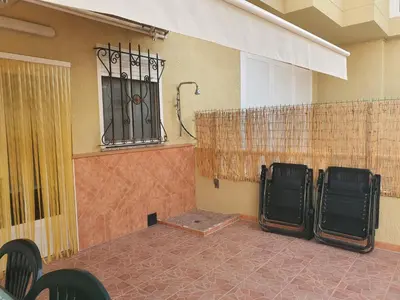 a room with a shower and a wall with a window at Loft Canet in Canet de Berenguer