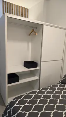 a bedroom with a bed and a book shelf at Loft Canet in Canet de Berenguer