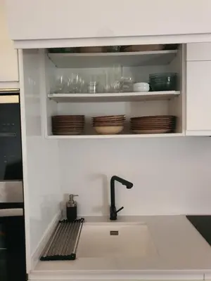 a kitchen counter with a sink in a kitchen at Loft Canet in Canet de Berenguer