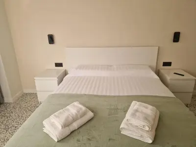 a bedroom with two white pillows on a bed at Relax Degrain in Cullera