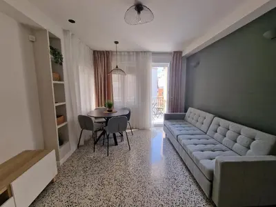 a living room with a couch and a table at Relax Degrain in Cullera