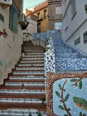 a set of stairs with blue and white tiles at Relax Degrain in Cullera