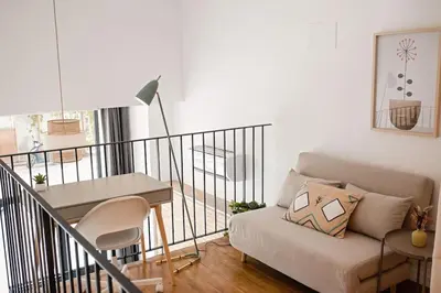 a living room with a couch and a table at Lofts plaza Orense A New and close to the beach in Valencia