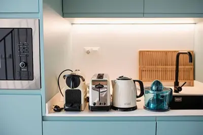 a kitchen counter with various appliances on it at Lofts plaza Orense A New and close to the beach in Valencia