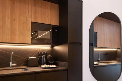 a kitchen with a black refrigerator and a sink at LOFT Accommodative A in Valencia