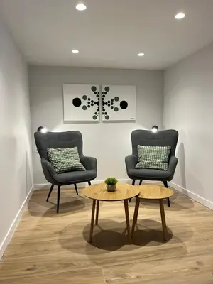 two chairs and a coffee table in a room at LOFT Accommodative A in Valencia