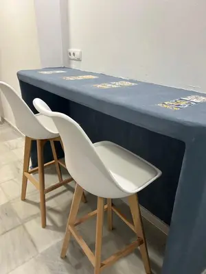 two white chairs sitting at a blue table at Mediterranéo in Valencia
