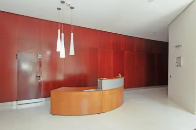 a lobby with red walls and a reception desk at GuestReady - Lovely flat with views in Valencia in Valencia