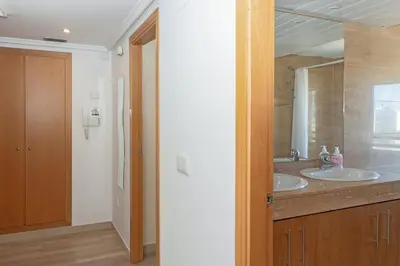 a bathroom with two sinks and a mirror at GuestReady - Lovely flat with views in Valencia in Valencia