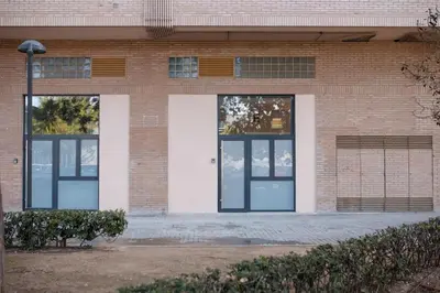 a brick building with a door and windows at Lofts Orense E Moderno y cercano a la playa in Valencia