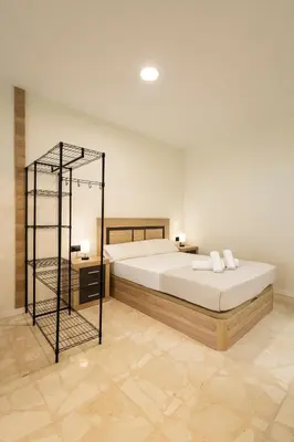 a bedroom with a large white bed in a room at Vera Suites by Concept Flats in Valencia