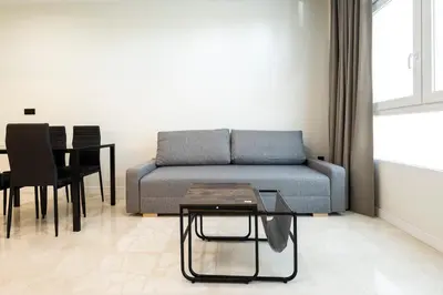 a living room with a couch and a table at Vera Suites by Concept Flats in Valencia